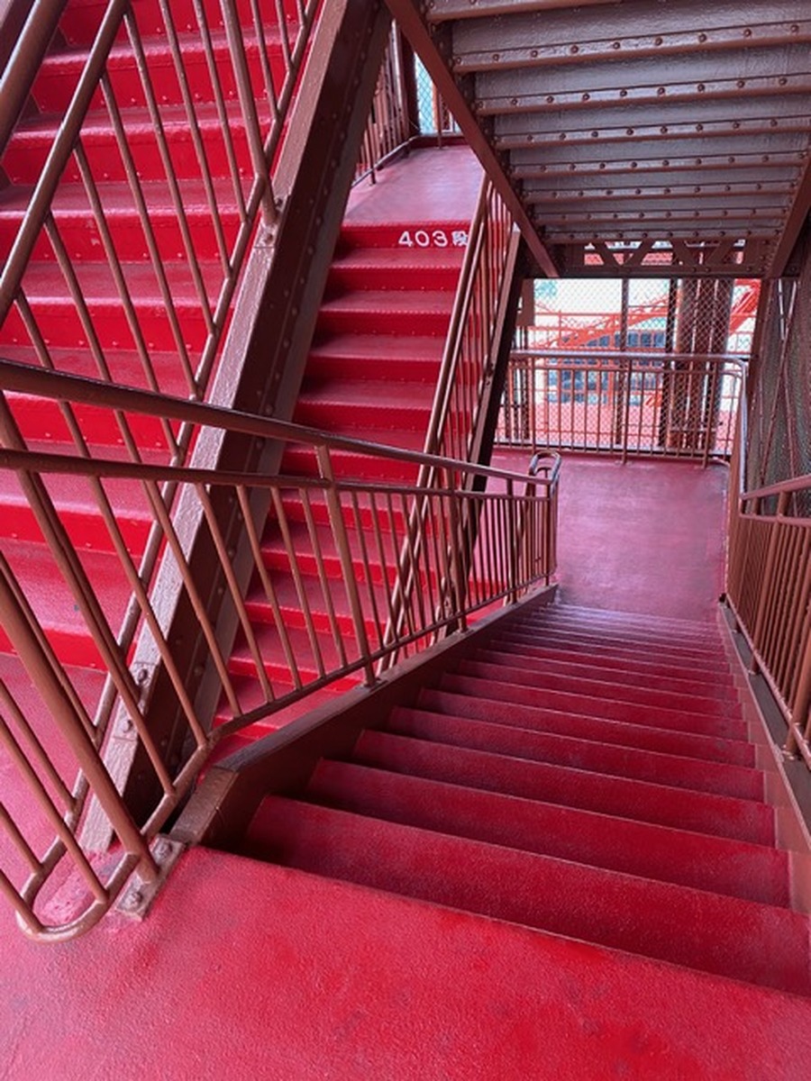 Outdoor stairs at Tokyo Tower with a sign marking 403 steps.